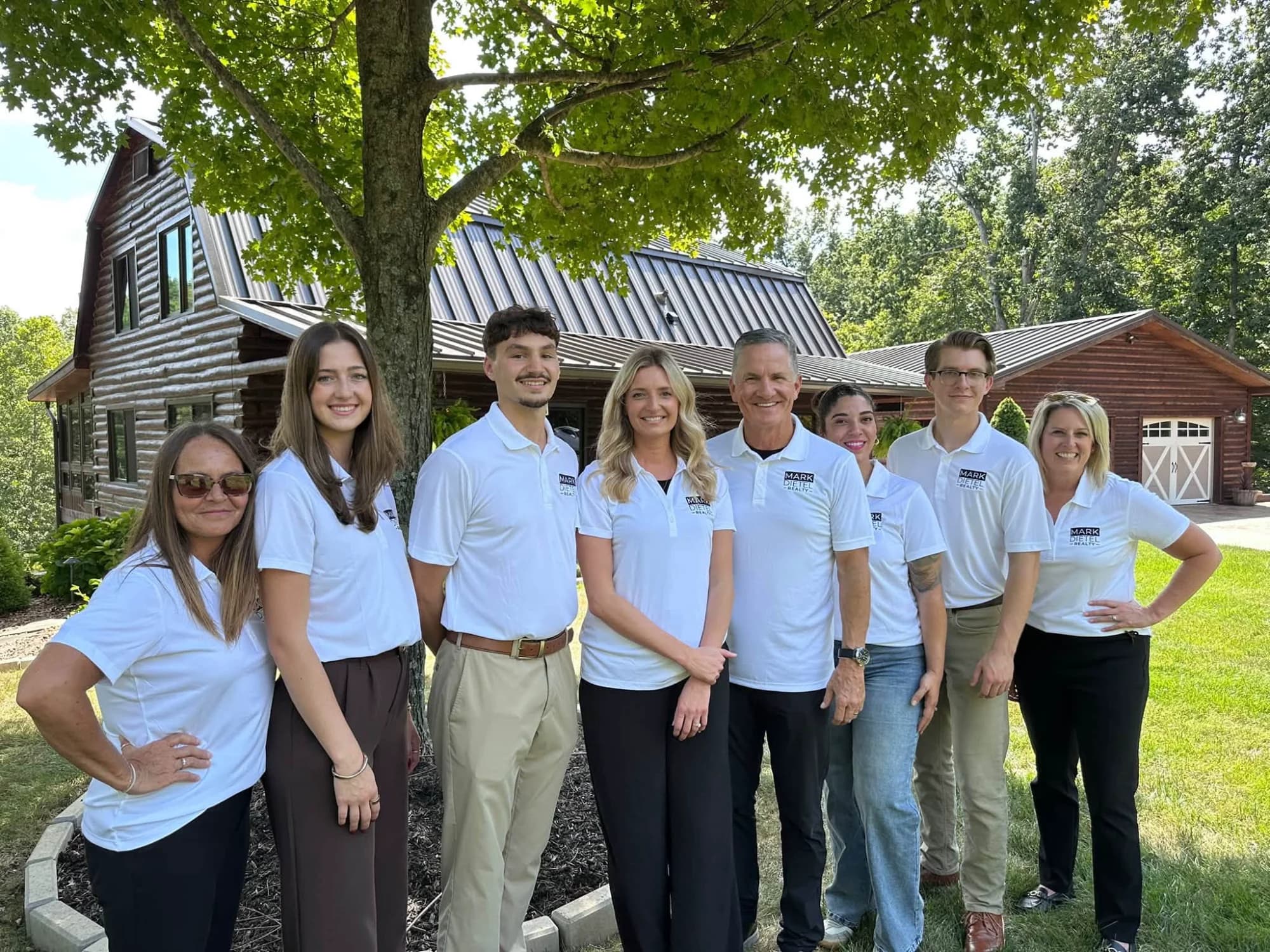 Mark Dietel Realty team outdoors in branded polos